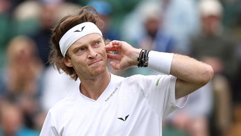 Russian tennis star Andrey Rublev smashes racquet against knee several times during Wimbledon loss