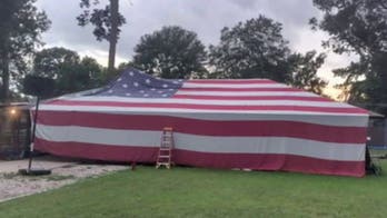 Louisiana family drapes home with 50-foot American flag to celebrate Independence Day