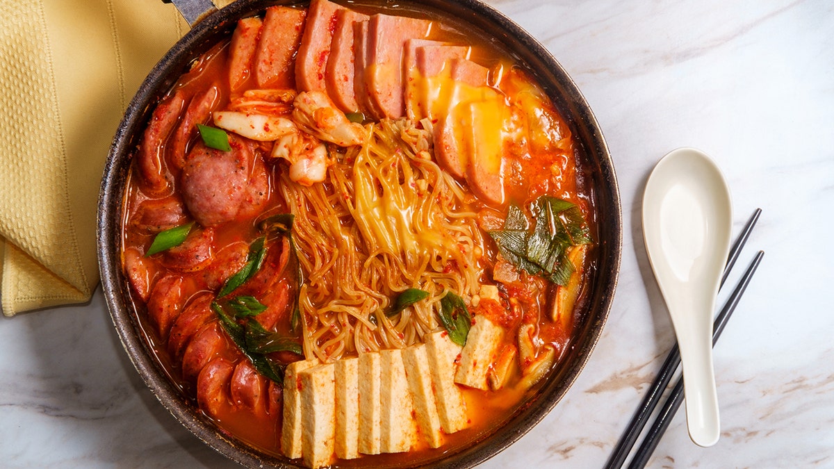 a bowl of Budae-jjigae, a Korean dish that features SPAM