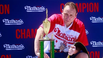 Joey Chestnut shows no rust as he downs 57 hot dogs in competition at Fort Bliss